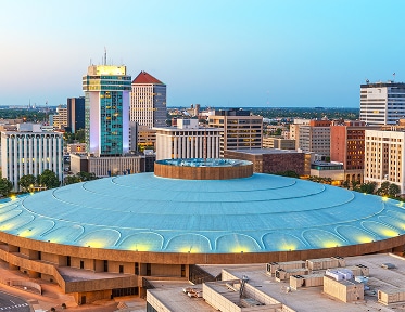 aerial view of arena and downtown buildings
