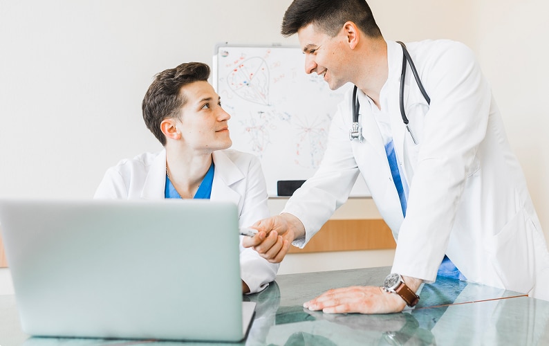 Cardiology doctors consulting on patient treatment plan at US Heart and vascular