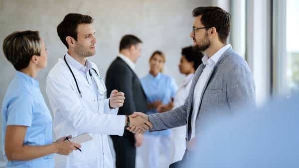 Doctor shakes hands with patient after consult at US Heart and vascular