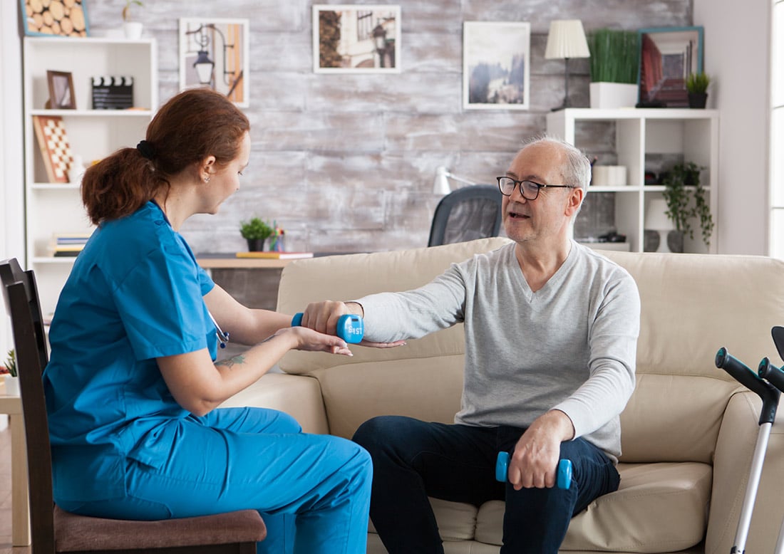Nurse checks elderly patient’s blood pressure at US Heart and vascular