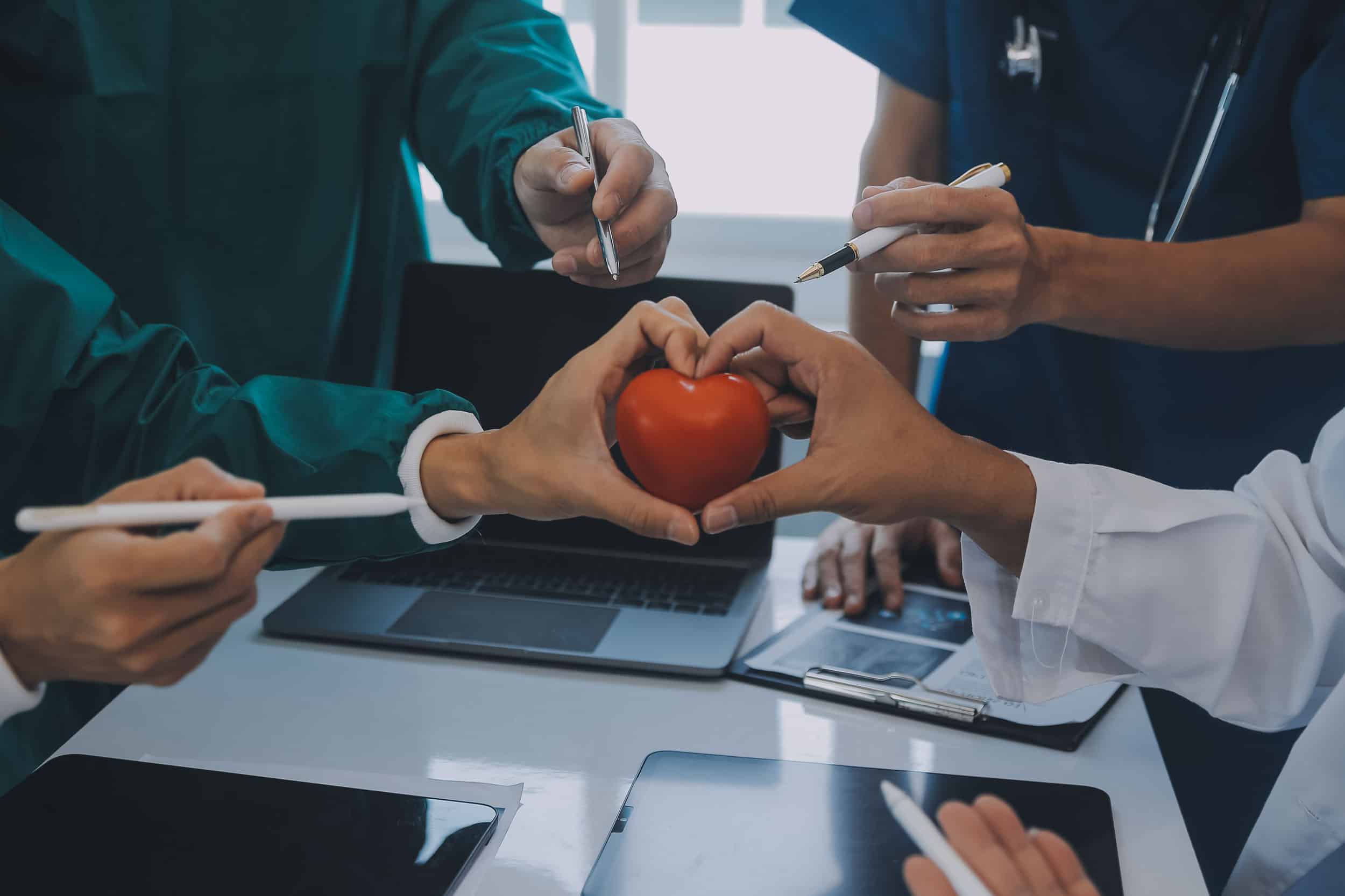 People holding the red heart